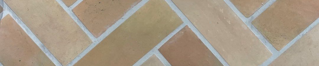 Terracotta effect tiles. Organic and full of character but with no sealing required. 