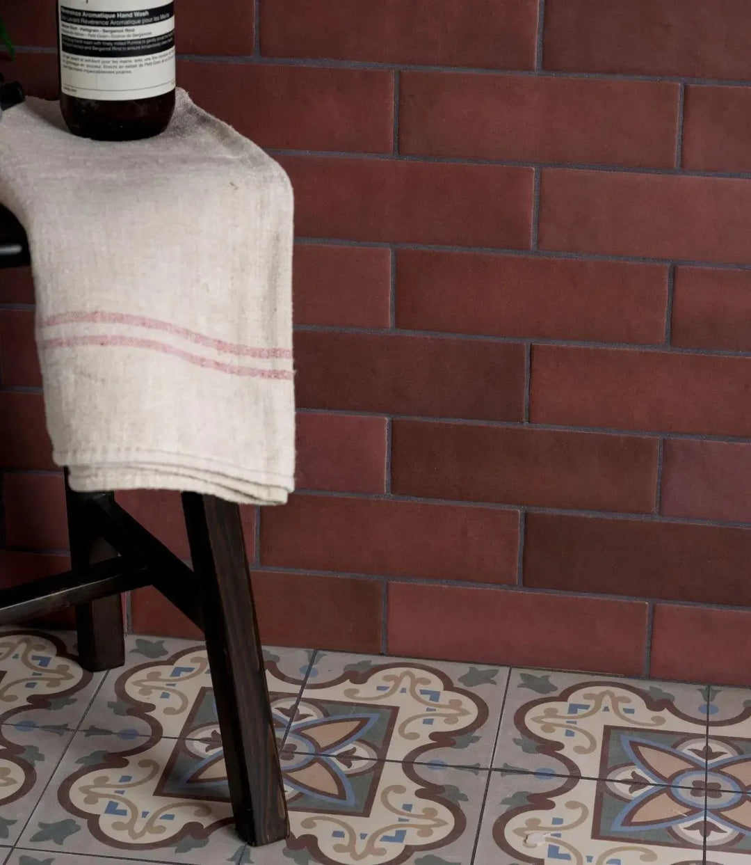 lava burgundy 6 5cm x 20cm lava burgundy by baked tiles featured in a beautiful interior
