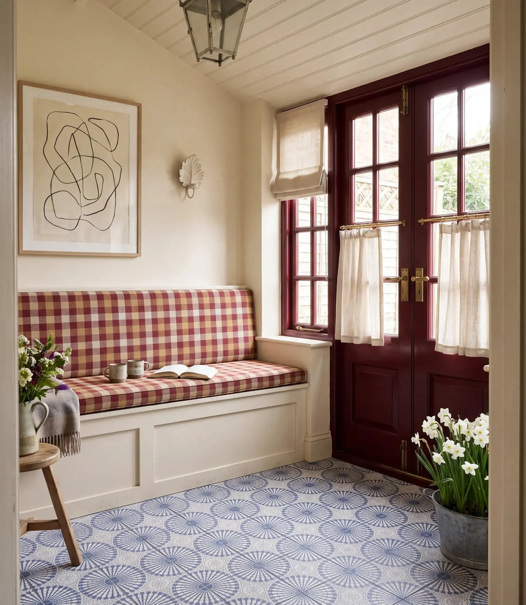 solstice indigo 20 x 20cm solstice indigo tiles in a garden porch with gingham window seat burgundy french doors lantern and pot of narcissi